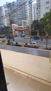 a view of a city street with cars and buildings at StudeXO in Ghaziabad