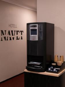 a hotel kiwi lobby with a microwave on a counter at Hotell Navet in Västervik +22 photos