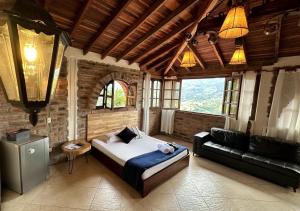 a bedroom with a bed and a couch in a room at Finca Hotel Tierra Verde in Girardota +48 photos