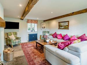 a living room with a couch and a table at 4 Bed in Sedbergh oc-sz595 in Milnthorpe