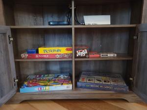 a book shelf filled with lots of books at Queen of Hearts in Rockbridge
