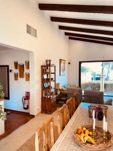 a living room with a table with fruit on it at Villa Buena Vista in Palmanova