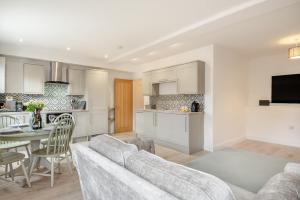 a living room and kitchen with a couch and a table at 2 Bed in Cromer oc-f28893 in Cromer