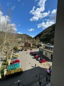 a view of a parking lot with cars parked at Dimora delle Terme in Porretta Terme