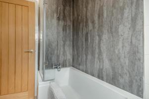 a bathroom with a bath tub and a shower at 2 Bed in Cromer oc-f28893 in Cromer +11 photos