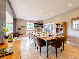 a dining room with a long table and chairs at 5 Bed in Durham oc-85257 in Lanchester
