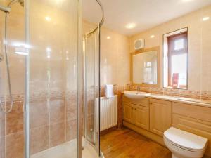 a bathroom with a shower and a toilet and a sink at 5 Bed in Durham oc-85257 in Lanchester +26 photos