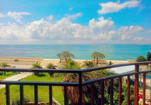 a view of the beach from a balcony at Captain's Homestay in Baisha