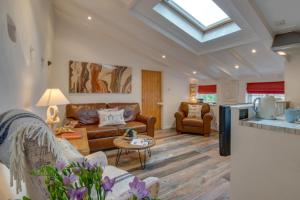 a living room with a couch and a table at 1 Bed in St. Ives oc-drift4 in St Ives