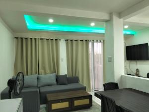 a living room with a couch and a table at Home stay in Pasig in Pasig