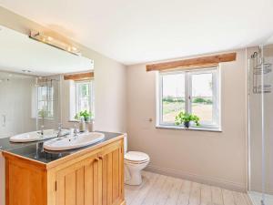 a bathroom with a sink and a toilet and a window at 3 Bed in Appleby-in-westmorland oc-94764 in Brampton +19 photos