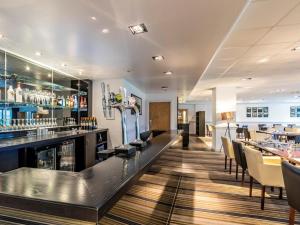 a bar at a restaurant with tables and chairs at 2 Bed in Saltash oc-87701 in St. Mellion