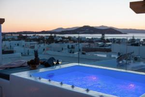 a swimming pool sitting on top of a roof at Kalypso Vacation Home Naxos Town in Naxos Chora