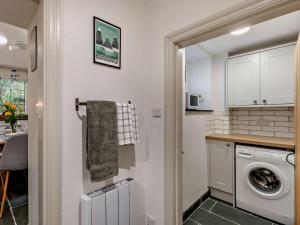 a kitchen with a washer and dryer in a room at 2 Bed in Keswick oc-90064 in Threlkeld