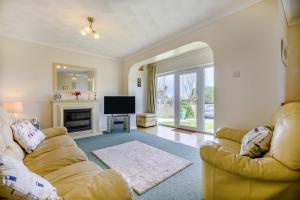 a living room with a couch and a television at 3 Bed in Padstow oc-p00131 in Saint Merryn +18 photos