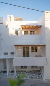 a white house with a view of the facade at Kalypso Vacation Home Naxos Town in Naxos Chora +56 photos