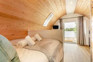 a bedroom with a large bed with a wooden ceiling at 1 Bed in Langtoft oc-l32683 in Langtoft