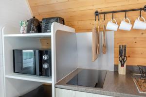 a kitchen with a microwave in a tiny house at 1 Bed in Langtoft oc-l32683 in Langtoft +9 photos