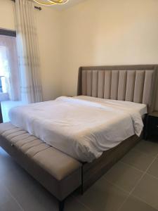 a bed in a bedroom with a white at EP2 Samarah Resort in Sowayma +20 photos