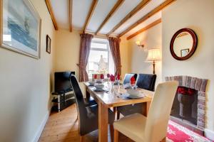 a dining room with a table and chairs at 3 Bed in Craster oc-79891 in Craster