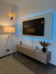 a living room with a flat screen tv on a wall at The Balaton Nest! in Alsóörs