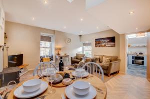 a kitchen and living room with a table and chairs at 2 Bed in Kettlewell oc-ds985 in Kettlewell