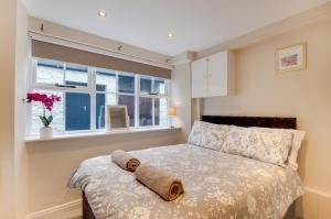 a bedroom with a bed and a window at 2 Bed in Kettlewell oc-ds985 in Kettlewell