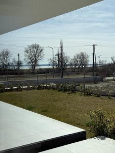 a view of a park with flowers and a road at The Balaton Nest! in Alsóörs