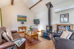 a living room with a couch and a wood stove at 1 Bed in Wonastow oc-l29426 in Wonastow