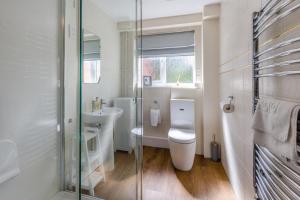 a white bathroom with a toilet and a sink at 5 Bed in Clows Top oc-m32976 in Bayton +33 photos