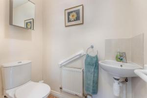a white bathroom with a toilet and a sink at 2 Bed in Weobley oc-c32945 in Weobley +24 photos