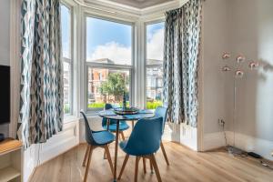 a dining room with a table and chairs and a window at 1 Bed in Bridlington oc-t30002 in Bridlington