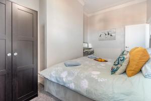 a bedroom with a bed with a bowl of fruit on it at 1 Bed in Bridlington oc-t30002 in Bridlington