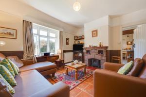 a living room with a couch and a fireplace at 2 Bed in Bacton oc-710 in Bacton