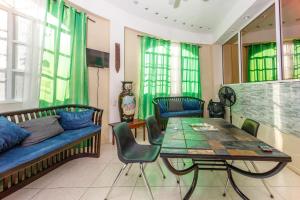 a living room with a couch and a table at Mirador Hotel in Corozal