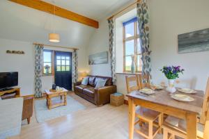 a living room with a table and a couch at 2 Bed in Roughton oc-1626 in Roughton