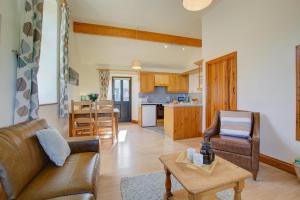 a living room with a couch and a table at 2 Bed in Roughton oc-1626 in Roughton