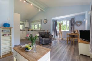 a kitchen and living room with a table at 2 Bed in Bush oc-b31845 in Bude