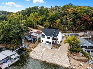 an aerial view of a house on the water at Modern Lakefront Escape | The Twelve in Camdenton