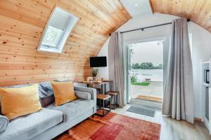 a living room with a couch and a table at 1 Bed in Langtoft oc-l32679 in Langtoft