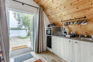 a kitchen with a large door leading to a patio at 1 Bed in Langtoft oc-l32679 in Langtoft