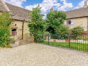 an entrance to a house with a wrought iron gate at 2 Bed in Lechlade oc-40192 in Langford