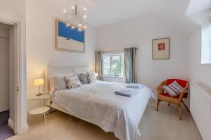 a bedroom with a bed and a chair and a window at 2 Bed in Woofferton oc-b29941 in Woofferton