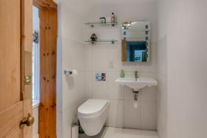 a white bathroom with a toilet and a sink at 2 Bed in Woofferton oc-b29941 in Woofferton +14 photos