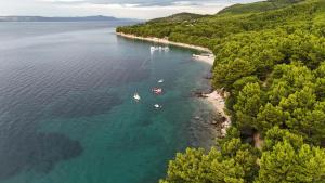 an aerial view of a beach with boats in the water at Karavan AIDA in Živogošće
