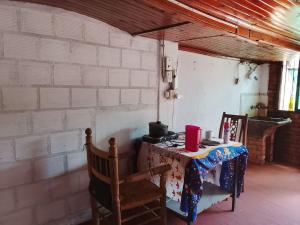 a table in a room with a table with a stove at alojamiento Villa sarita in Posadas