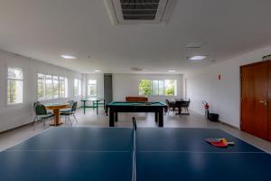 a large room with a ping pong table in it at Guarujá Vivah in Guarujá