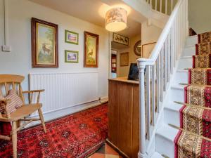 a staircase in a home with a desk and a chair at 2 Bed in Lechlade oc-40194 in Langford