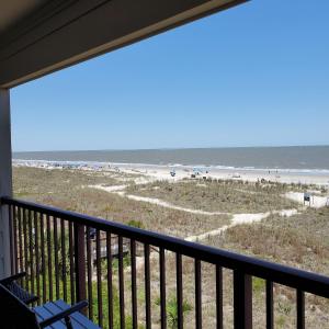 a balcony with a view of the beach at Beach Skybox HHI in Hilton Head Island