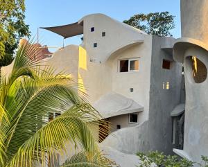 a building with a staircase leading up to it at Calle Ouvert in Mérida